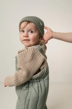 Atlas, Beanie